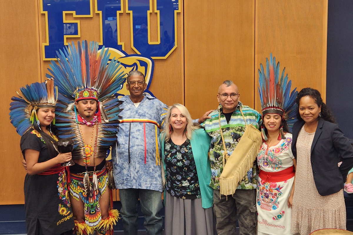 FIU Faculty and Indigenous Dancers posing at FIU